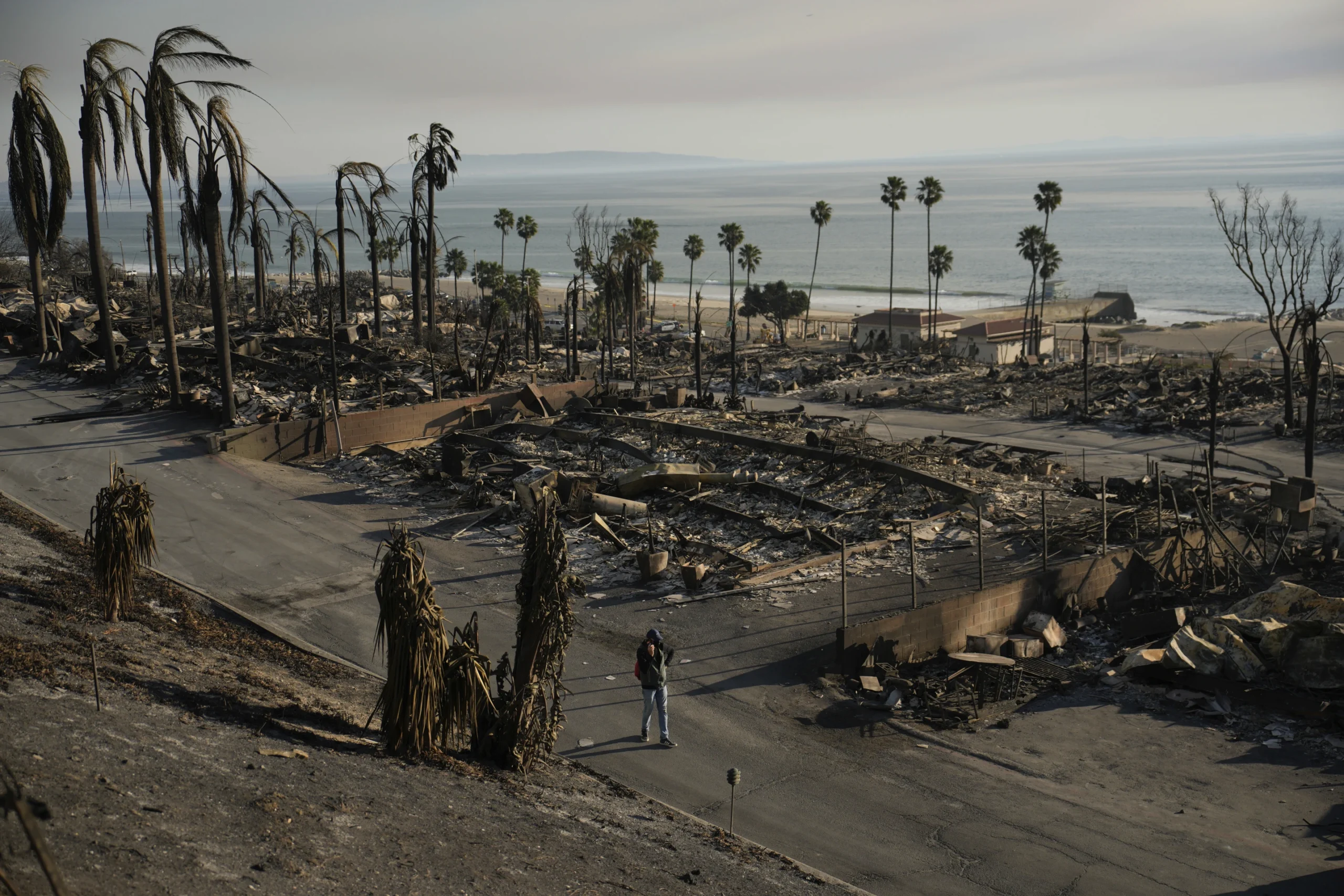 With their Los Angeles-area homes still smoldering, families return to search the ruins for memories